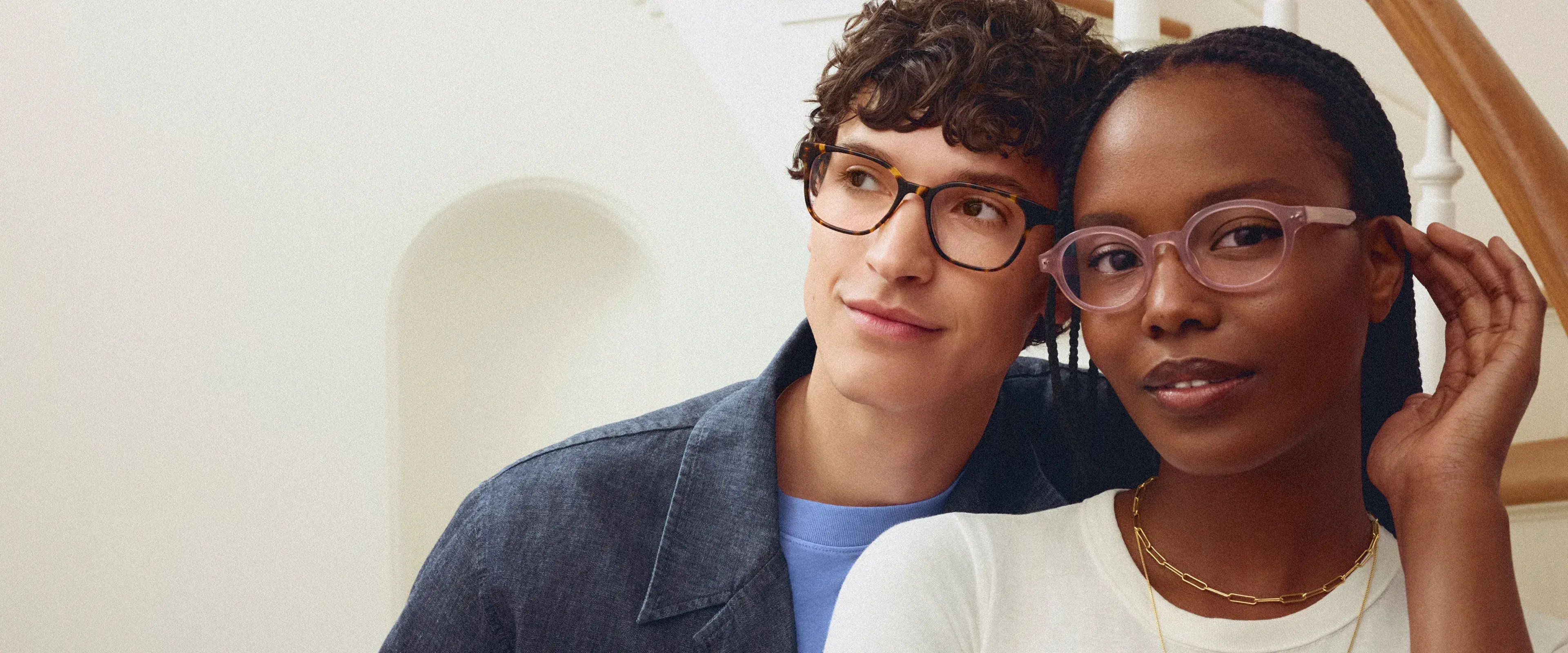 Two people wearing stylish eyeglasses
